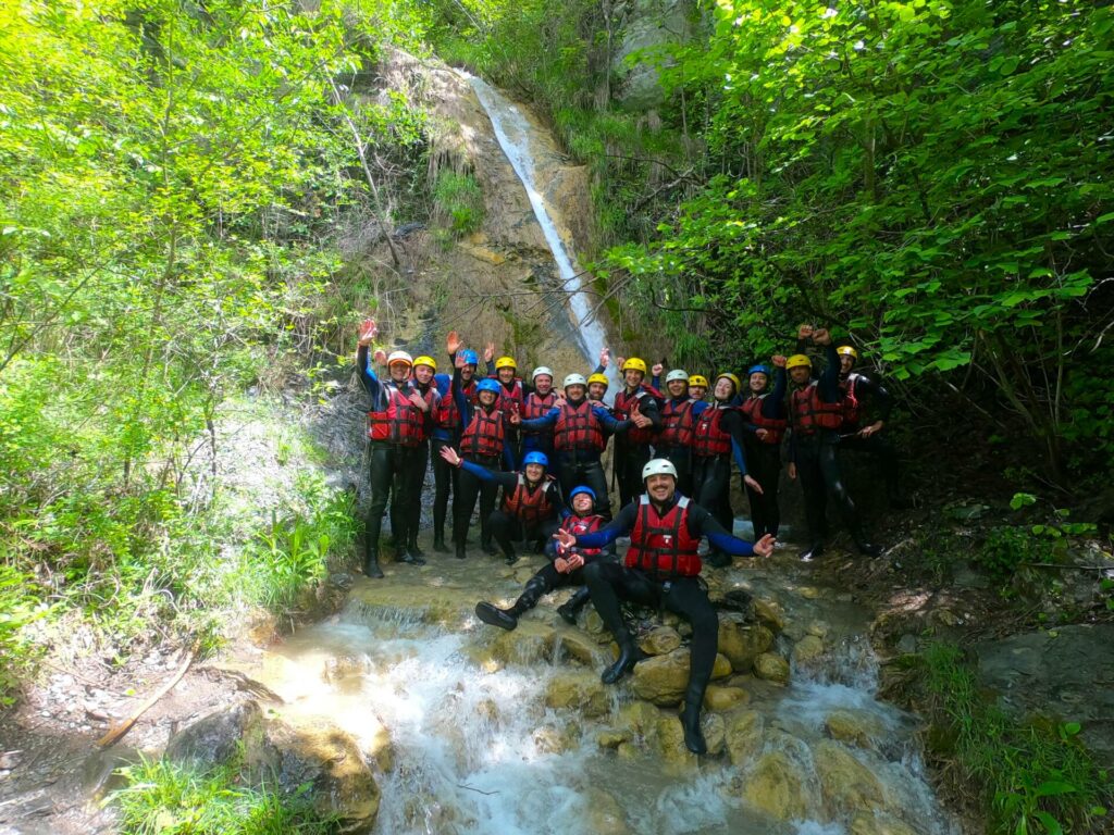 Group under a waterfall in the Ubaye